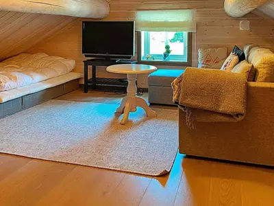 a living room with a couch and a table at 10 person holiday home in Rauland-By Traum in Rauland