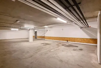 an empty parking lot in an empty parking garage at Rumi Hostel in Trondheim