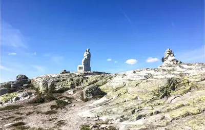 a statue on top of a mountain with a lighthouse at 4 Bedroom Pet Friendly Home In Eggedal in Eggedal