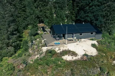 an aerial view of a house on a mountain at Modalen Fjord Cottage in Mo