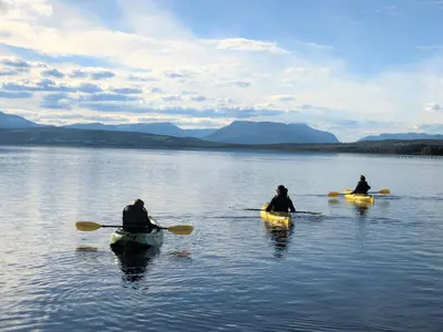 three people in kayaks on a body of water at Bualie Golsfjellet in Gol