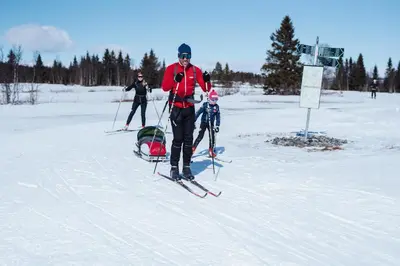a man is standing on skis in the snow at Bualie Golsfjellet in Gol