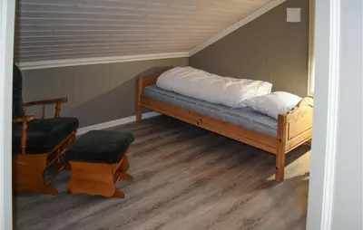 a bed with white pillows at Lovely Home In Hjartdal With Sauna in Hjartdal