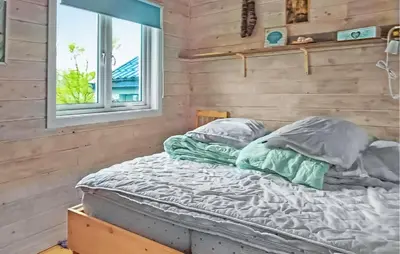 a bed in a room with a window at Pet Friendly Home In Roan in Moen
