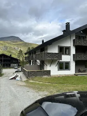 a house with a car parked in front of it at Kozy apartment in Hemsedal, centrally located in Hemsedal