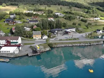 an aerial view of a small town next to the water at Moderne panoramaleilighet 3-roms i Olden in Olden