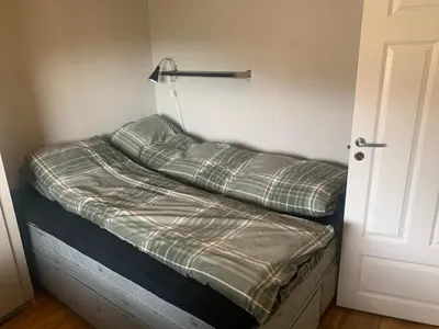 a room with a bed with a pillow on it at Hemsedal Ulsåk in Torset
