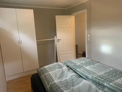 an empty bedroom with a bed and a closet at Hemsedal Ulsåk in Torset