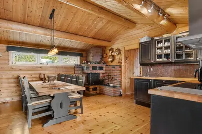 a kitchen with a table and chairs in a cabin at Trysilfjellet in Trysil