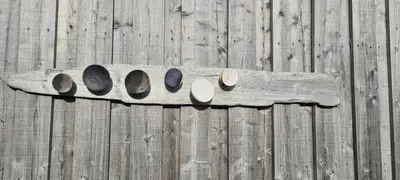 a piece of wood on a wooden fence at Exceptional Cottage 2 meters from the sea, possible to rent boat, Bekkjarvik, 60 km from Bergen in Gauksheim
