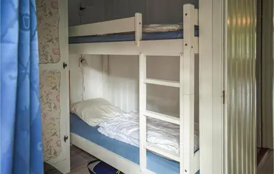 a couple of bunk beds in a room at 4 Bedroom Nice Home In Vikersund in Vikersund