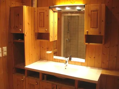 a bathroom with a sink and a mirror at Svarthamar - cabin with amazing view in Ål