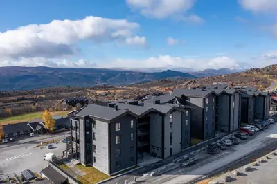 an aerial view of a building in a city at Riddertunet deluxe in Beitostøl
