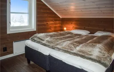 a large bed in a room with a window at Pet Friendly Home In Gol With Sauna in Gol
