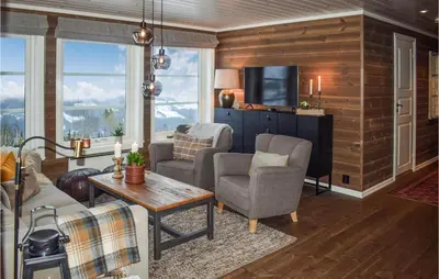 a living room with a couch and chairs and a tv at Pet Friendly Home In Gol With Sauna in Gol