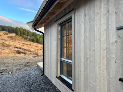 a building with a window on the side of it at Aurdalsåsen panorama in Aurdal