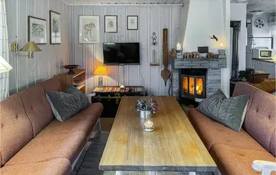 a living room with two couches and a coffee table at 3 Bedroom Lovely Home In Vinstra in Vinstra