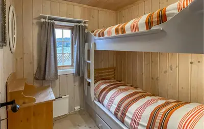two bunk beds in a room with a window at 3 Bedroom Lovely Home In Vinstra in Vinstra