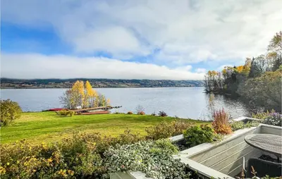 a view of a large lake with a picnic table at Lovely Home In Bjoneroa With Wifi in Bjoneroa