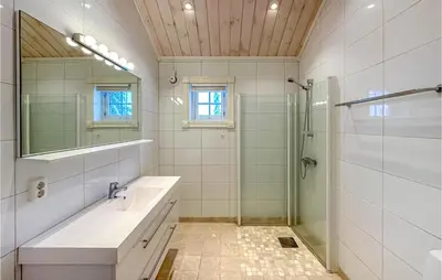 a bathroom with a sink and a shower at Beautiful Home In Sjusjøen With Wifi in Sjusjøen