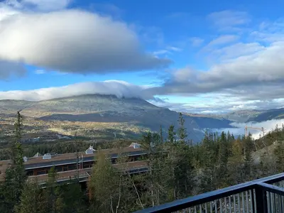 a view of a mountain with a cloud on it at Astonishing Mountain Lodge at the top of Gaustablikk, 25m2 west facing terrace, 3 bedrooms in Gaustablikk