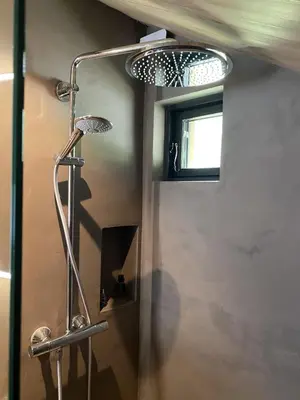 a shower in a bathroom with a mirror at Beautifully styled mountain lodge with high standards, 10 minutes from Geilo in Geilo