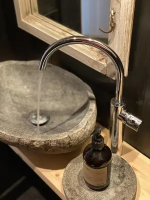 a bathroom sink with a bottle of soap at Beautifully styled mountain lodge with high standards, 10 minutes from Geilo in Geilo