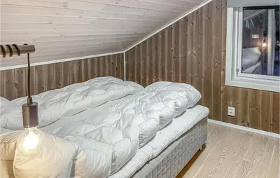 a mattress sitting in a room next to a window at 3 Bedroom Gorgeous Home In Brøttum