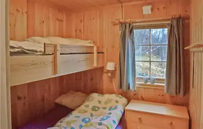 a bedroom with two bunk beds and a window at Awesome Home In Hemsedal With Wifi in Hemsedal