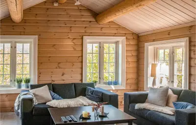a living room with two couches and a table at 3 Bedroom Nice Home In Oppdal in Oppdal