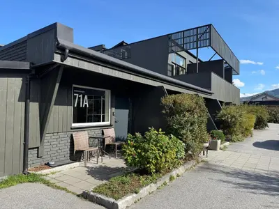 a building with a table and chairs outside of it at Sentrumsvegen - Private Studio Apartment in Gol in Gol