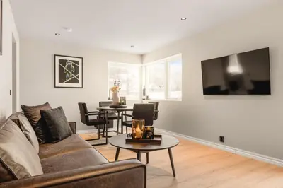a living room with a couch and a table at Odda View - 4BR & 2BR & 1BR - B11 in Odda