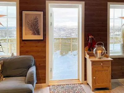 a living room with a couch and a sliding glass door at 7 person holiday home in Rauland-By Traum in Rauland