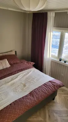 a bedroom with a bed and a window at Skogro ved Norefjell in Noresund