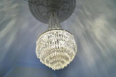 a large chandelier hanging from a ceiling at Jugend 1905 in Ålesund