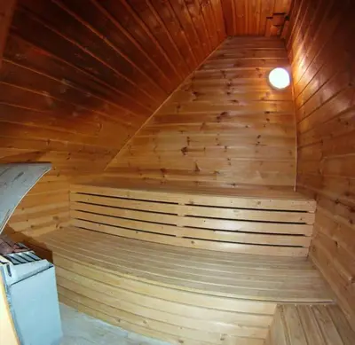 a wooden sauna with a staircase in a room at Topfloor Apartment Separate Entranc Nice view Stord in Fitjar
