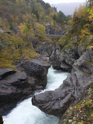 a river in a mountain with rocks and trees at New, Mountain paradise, biking, alpine touring, skiing in & out in Tyinkrysset