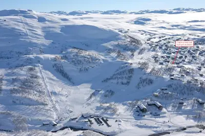 an aerial view of a ski resort in the snow at New, Mountain paradise, biking, alpine touring, skiing in & out in Tyinkrysset