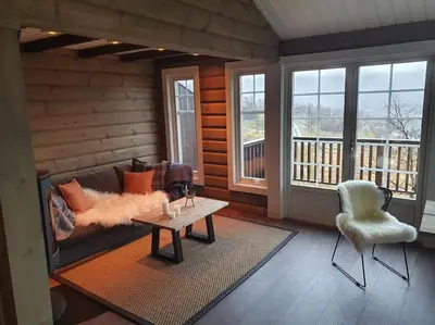a living room with a couch and a table at New, Mountain paradise, biking, alpine touring, skiing in & out in Tyinkrysset