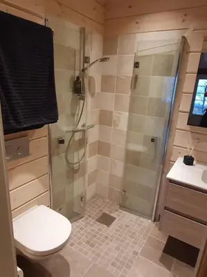 a bathroom with a shower and a toilet and a sink at New, Mountain paradise, biking, alpine touring, skiing in & out in Tyinkrysset