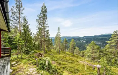 a view from the deck of a house with trees at 3 Bedroom Amazing Home In Eggedal in Eggedal
