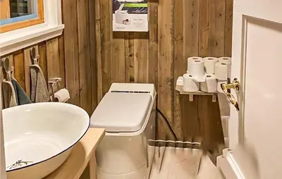 a bathroom with a toilet and a sink at 3 Bedroom Amazing Home In Eggedal in Eggedal