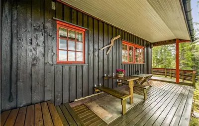 a wooden cabin with a bench on a deck at 3 Bedroom Amazing Home In Eggedal in Eggedal
