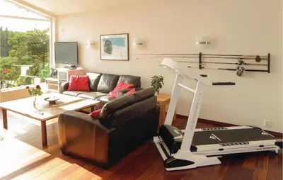 a living room with a mop and a couch at Gorgeous Home In Sveio With Kitchen in Sveio