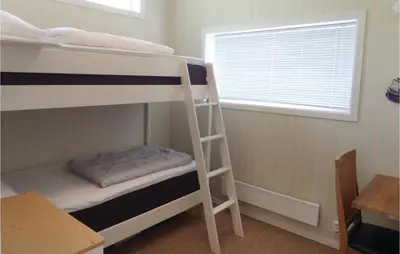 a bunk bed room with two bunk beds and a window at Gorgeous Home In Sveio With Kitchen in Sveio