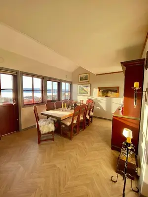 a dining room with a table and chairs at Apartment City Beitostølen in Beitostøl