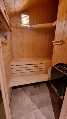a small sauna with a bench in a room at Heimstølen - Cabin at Sørbølfjell in Flå