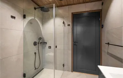 a shower with a glass door in a bathroom at Stunning View In Holiday Home in Gol