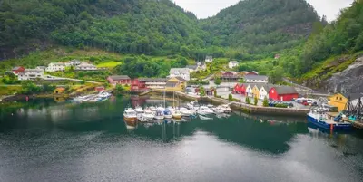 a group of boats are docked in a harbor at Leirvik i Sogn-Apartment in Leirvik