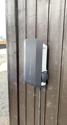 a television on the side of a wooden wall at Gaustablikk - ski in & out apartment - Mountain View in Gaustablikk